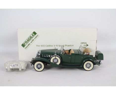 Danbury Mint - A boxed Danbury Mint diecast 1:24 scale 1932 Cadillac V-16 Sport Phaeton.. The model in green appears to be in