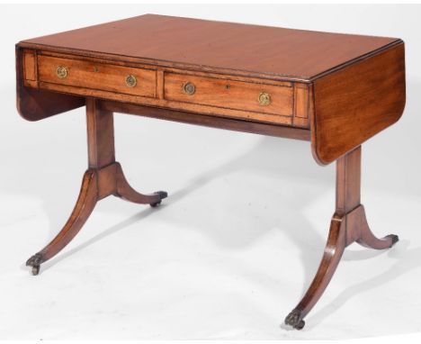 A REGENCY STYLE MAHOGANY SOFA TABLE with end flaps and two drawers with ring handles, on twin column supports and claw feet, 