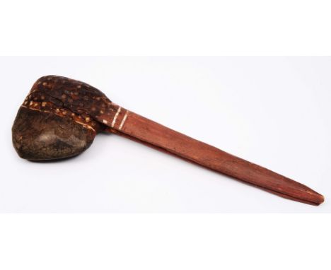 AN AUSTRALIAN ABORIGINAL PRIMITIVE STONE AXE the wooden handle decorated with gum, red ochre and white clay 28.5cm long