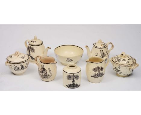 A COLLECTION OF 18TH CENTURY CREAMWARE POTTERY with black printed decoration, comprising two teapots and covers, a cylindrica