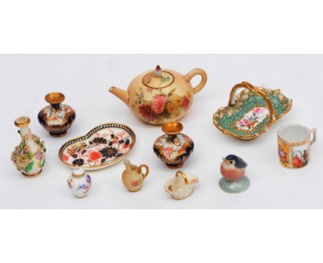 A GROUP OF ELEVEN MINIATURE CERAMIC ITEMS to include a Royal Worcester teapot, 7cm high and an Augustus Rex tankard, 3.7cm hi