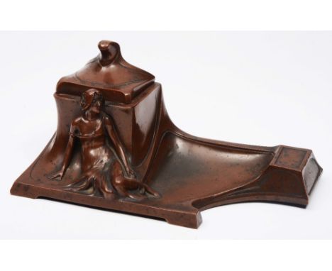 A FRENCH ART NOUVEAU BRONZE INKWELL with ceramic liner and figure ornament 24cm wide 