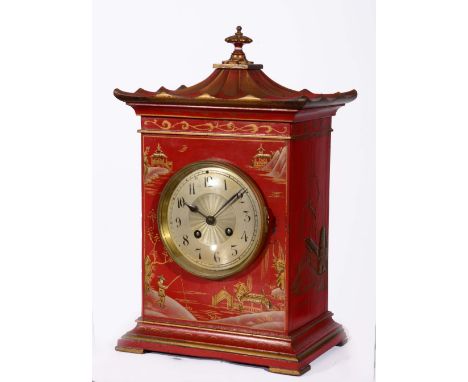 AN EDWARDIAN STRIKING MANTLE CLOCK with circular steel dial in a chinoiserie red lacquered pagoda case, on bracket feet 34cm 