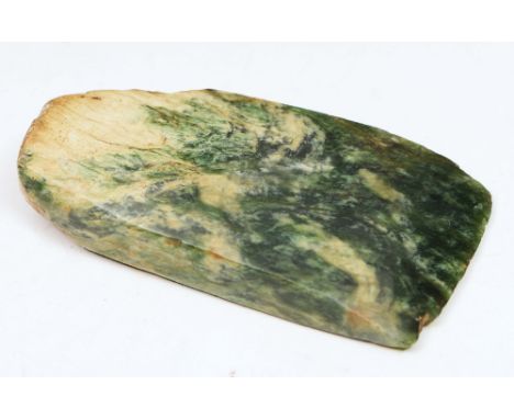 A MAORI GREENSTONE AXE HEAD of tapering form with natural striations 7.7cm long x 3.9cm wide at head