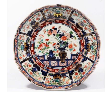 A LARGE JAPANESE POLYCHROME ENAMEL CHARGER  decorated with a central urn of flowers within a panelled border, old repairs 45c