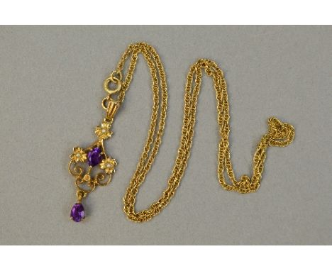 A 9CT AMETHYST SET OPENWORK PENDANT, on a 9ct gold chain