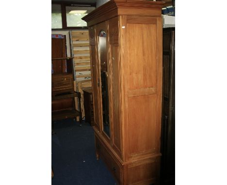 AN EDWARDIAN SATINWOOD SINGLE  MIRROR DOOR WARDROBE above a single drawer 