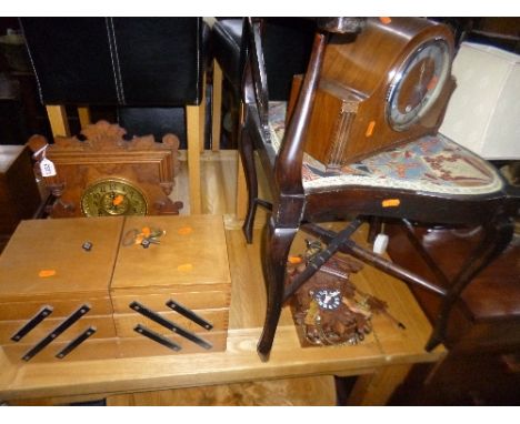 A 20TH CENTURY CARVED OAK MANTLE CLOCK, a walnut mantle clock, a modern cuckoo clock and a canti lever sewing box (4)