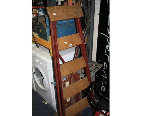 AN INDUSTRIAL METAL AND BEECH PAIR OF STEP LADDERS, with Kalmine embossed on the top step