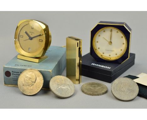 A BOX OF FOUR COINS, two clocks and a Ronson lighter