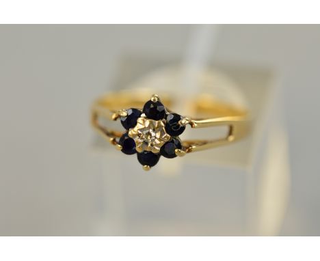 A 9CT SAPPHIRE AND DIAMOND CLUSTER RING, ring size M, approximate weight 1.5 grams