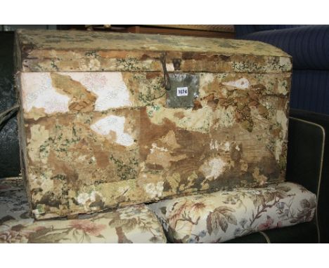 A VINTAGE PINE DOMED TRUNK, partly stripped of wallpaper and decoupage interior
