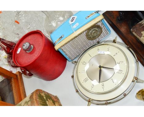 THREE ITEMS OF MID CENTURY KITSCH, including a Dansette Gem radio in baby blue, a Metamec wall clock and a red leatherette ic