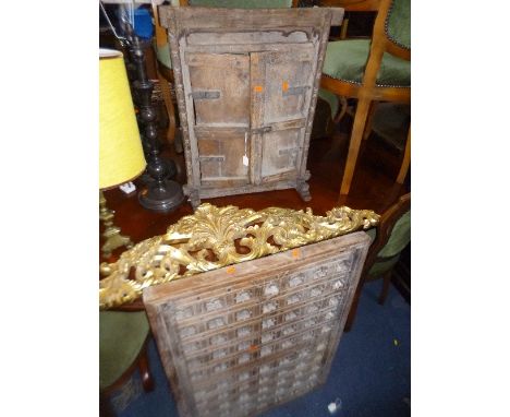 A FAR EASTERN HARDWOOD TABLE TOP ITEM WITH DOUBLE DOORS, another hardwood plaque and two gilt and foliate carved wall mounts 