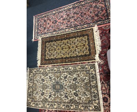 A WOOL PILE CARPET SQUARE, green ground, approximate size 251cm x 166cm, together with three wool pile rugs (4)