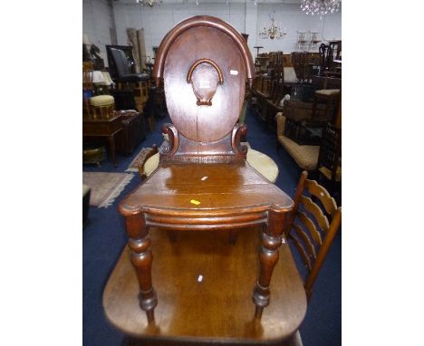 AN EARLY 20TH CENTURY CARVED OAK HALL CHAIR, and two rush seated ladder back chairs (3)