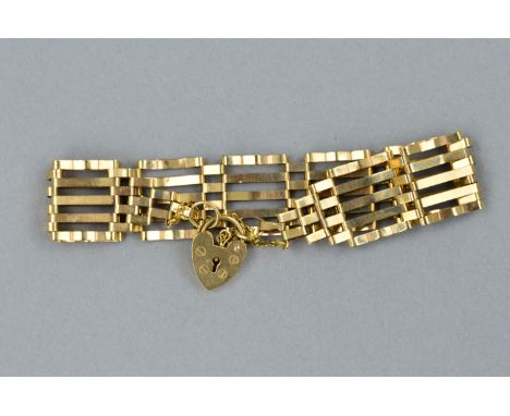 A LATE 20TH CENTURY 9CT GOLD GATE BRACELET, fitted to a padlock and safety chain, bracelet measuring approximately 165mm in l