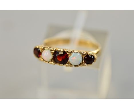 A 9CT OPAL AND GARNET SET RING, ring size J, approximate weight 2.8 grams