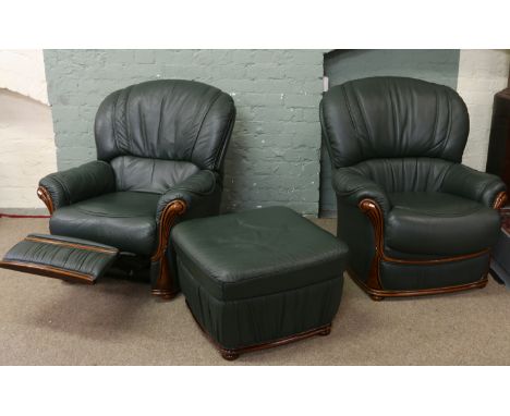 A green leather four piece suite trimmed in mahogany and comprising of three seat sofa, two matching chairs one of which recl