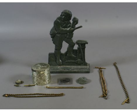 A small box of collectables including a metal door stop and mixed jewellery including watch chains and a Royal Wedding crown.