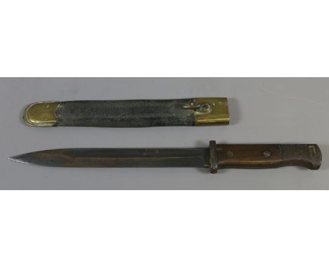 An early C20th short bayonet with leather and brass scabbard.