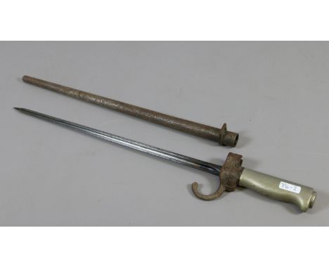 An early C20th French spike bayonet with metal scabbard.