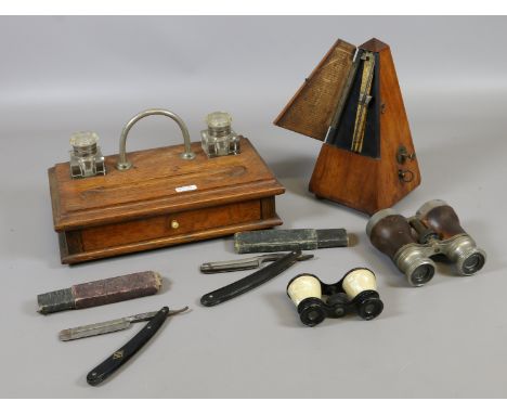 An oak desk stand, two pairs of binoculars, two cut throat razors and a mahogany cased metronome. 