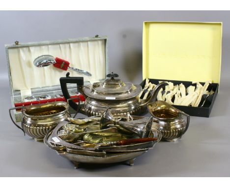 A silver plated three part tea service and other silver plate including cake basket and flatwares etc.