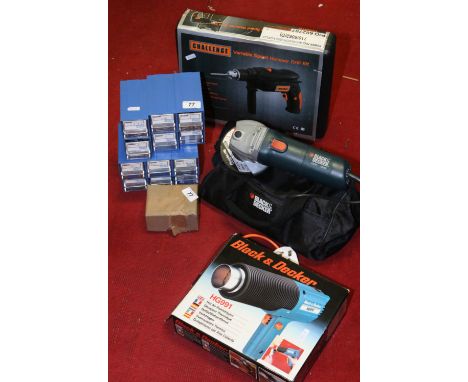 A quantity of boxed power tools to include Black and Decker heat gun, Challenge hammer drill, screws and cased angle grinder.