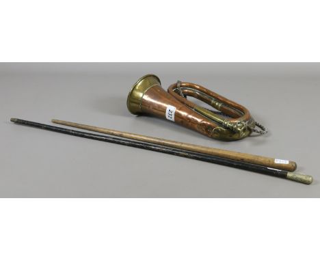 A copper and brass bugle with inscription 'Church Lads Brigade Westminster 1900', along with two vintage swagger sticks.
