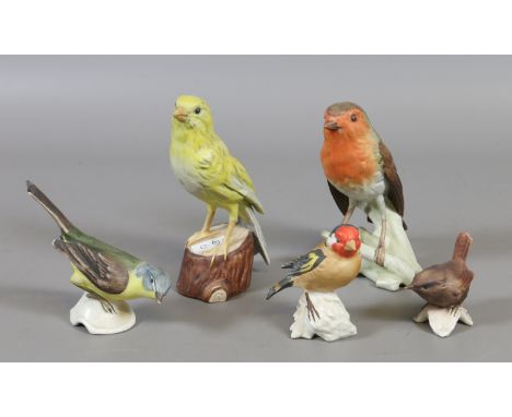 A collection of five Goebel bisque bird figures made in West Germany.