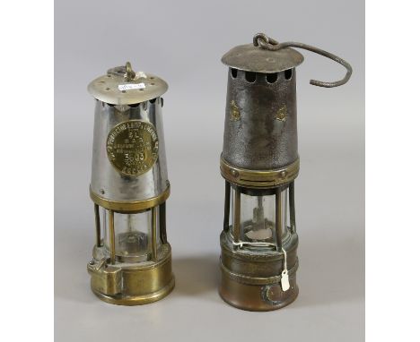 Two vintage brass based miners lamps including an Eccles type SL projector lamp and one similar.