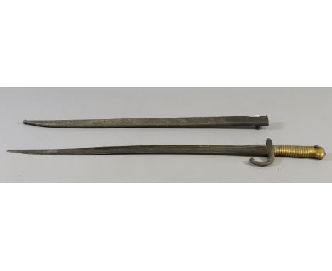 A C19th French sword bayonet and scabbard inscribed 1875.