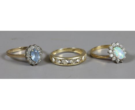 An 18ct gold opal and diamond ring (AF) a 14ct and white paste ring and a 9ct gold gem set ring.