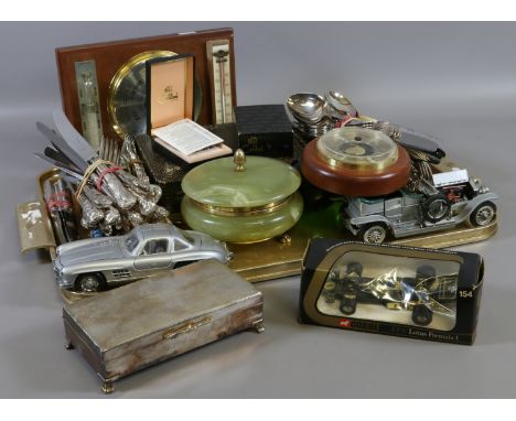 A tray of mixed items including silver plated flatware, two barometers, Diecast model cars including Franklin Mint Mercedes a