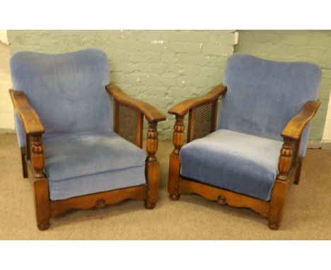An oak and bergere cottage three piece suite comprising two seat sofa and two armchairs.