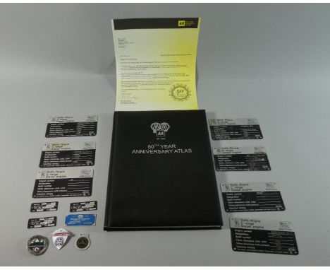 A Motoring Atlas and Tin Containing Enamelled Badges and Rolls Royce Diesel Engine Plates 