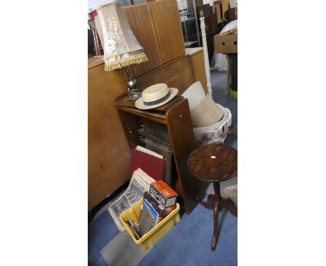 A Collection of Various Sundries to Include Wine Table, Book Cases, Table Lamp, Vintage Newspapers, Morris Minor Operation Ma