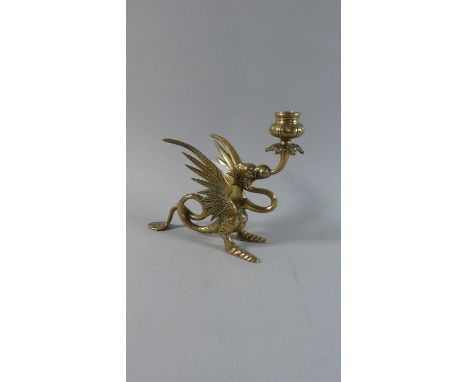 A Brass Novelty Candle Stick in the Form of a Winged Dragon, 18cm high 