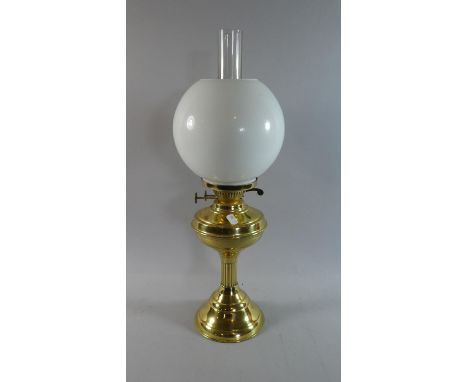 A Brass Oil Lamp with Opaque Glass Shade 