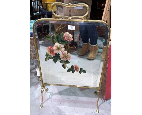 An Art Nouveau painted mirror firescreen in brass frame; a modern footstool in gold 