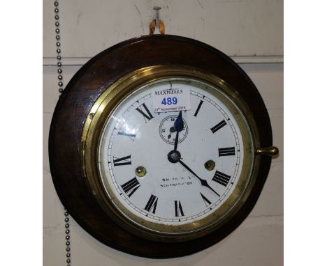 A brass ship's clock by Smith &amp; Sons, Southampton with plaque 'SS Adriatic' (enamel chipped to lower dial) 