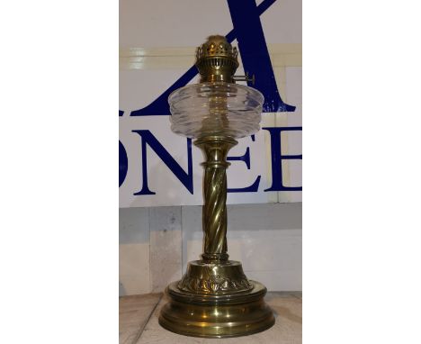 A Victorian brass oil lamp with glass reservoir 