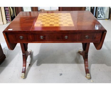 A Regency style inlaid mahogany sofa/games table with chess/backgammon board by Wade; a similar chair 