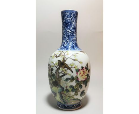 A Chinese porcelain vase of ovoid form with slender neck, 20th century, decorated with birds in a naturalistic setting, seal 