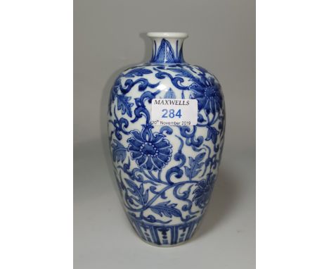 A Chinese blue and white ceramic plum shaped vase with floral decoration, ht 20cm 