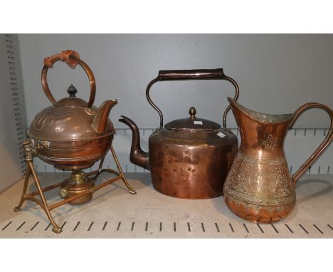 An Arts &amp; Crafts copper kettle on stand, in the style of Christopher Dresser; a Georgian copper kettle; an Islamic copper