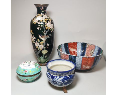 A Chinese covered circular metal box decorated in polychrome enamels, diameter 11 cm; an oriental cloisonné baluster vase dec