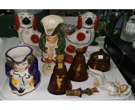 A pair of 19th century Staffordshire King Charles spaniels; 2 19th century toby jugs; a bisque figure, boy on swing; a trinke