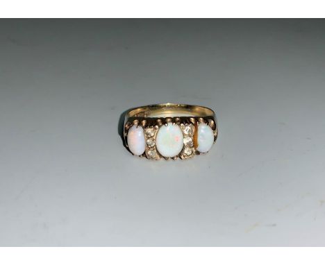 A 9 carat Victorian style dress ring set opal and diamond simulant, 3.4 gm 